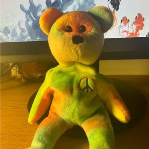 Vintage 90’s peace beanie baby. No tag, plastic is still there.